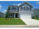 Charming two-story home with a manicured lawn, two-car garage, and inviting curb appeal at 204 Valerio St., Myrtle Beach, SC 29579