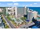 Aerial view of the resort featuring its multiple pools, lush landscaping, and nearby beach access under a blue sky at 205 74Th Ave. N # 1607, Myrtle Beach, SC 29577