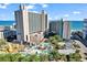 Aerial view showcases the resort's pool area, water park, and oceanfront location on a sunny day at 205 74Th Ave. N # 1607, Myrtle Beach, SC 29577