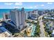 Aerial view showcasing the resort's multiple pools, water features, and proximity to the beach and ocean at 205 74Th Ave. N # 1607, Myrtle Beach, SC 29577