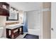 Bathroom features a dark wood vanity, a mosaic tile backsplash, and a shower-tub combination at 205 74Th Ave. N # 1607, Myrtle Beach, SC 29577