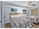 Bright bedroom with two queen beds, nautical decor, ceiling fan, and neutral walls for a relaxing retreat at 205 74Th Ave. N # 1607, Myrtle Beach, SC 29577