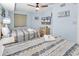 Bright bedroom with two beds, ceiling fan, nautical decor, and ample space for a relaxing vacation at 205 74Th Ave. N # 1607, Myrtle Beach, SC 29577