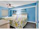 Cheerful bedroom with two beds, floral bedding, ceiling fan, and ocean-themed artwork, creating a coastal getaway at 205 74Th Ave. N # 1607, Myrtle Beach, SC 29577