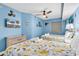 Inviting bedroom with two beds, TV, nautical decor, ceiling fan, and soft lighting for a relaxing stay at 205 74Th Ave. N # 1607, Myrtle Beach, SC 29577