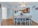 Comfortable dining area with seating for six, open to the kitchen in a bright and airy space at 205 74Th Ave. N # 1607, Myrtle Beach, SC 29577