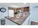 Well-lit kitchen with granite countertops, light wood cabinetry, and white appliances at 205 74Th Ave. N # 1607, Myrtle Beach, SC 29577
