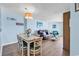 Living and dining area with a modern table and chairs, a plush leather couch, and light blue walls at 205 74Th Ave. N # 1607, Myrtle Beach, SC 29577