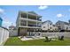 Beautiful three-story home featuring a private backyard oasis with a sparkling pool and bar area at 221 N Waccamaw Dr., Murrells Inlet, SC 29576