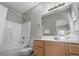 Bright bathroom featuring vanity and shower with tub, offering a clean and simple design at 221 N Waccamaw Dr., Murrells Inlet, SC 29576