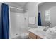 Bright bathroom featuring a shower, vanity, mirror, and essential fixtures for a clean and functional space at 221 N Waccamaw Dr., Murrells Inlet, SC 29576