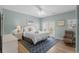 Cozy bedroom with a queen bed, a ceiling fan, and a private patio at 221 N Waccamaw Dr., Murrells Inlet, SC 29576
