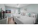 Charming bedroom with hardwood floors, two double beds, light blue walls and access to a balcony at 221 N Waccamaw Dr., Murrells Inlet, SC 29576