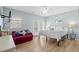 Comfortable bedroom with light blue walls, white bedding, and a private balcony at 221 N Waccamaw Dr., Murrells Inlet, SC 29576
