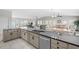Kitchen with granite counters, stainless steel appliances, and an open view to the living room at 221 N Waccamaw Dr., Murrells Inlet, SC 29576
