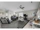 Open living room with a ceiling fan, tile floors, and comfortable seating at 221 N Waccamaw Dr., Murrells Inlet, SC 29576
