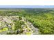 Aerial view of a residential neighborhood with a tranquil pond and lush green surroundings at 221 Rivers Edge Dr., Conway, SC 29526