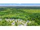 Aerial view of a residential area surrounded by a beautiful, sprawling green forest at 221 Rivers Edge Dr., Conway, SC 29526