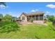 Spacious fenced-in backyard featuring screened porch, outdoor patio, and lush green lawn at 221 Rivers Edge Dr., Conway, SC 29526
