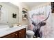 Charming bathroom with a decorative shower curtain and wooden storage shelves at 221 Rivers Edge Dr., Conway, SC 29526