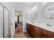 Well-lit bathroom with double sink vanity, and a shower with glass doors at 221 Rivers Edge Dr., Conway, SC 29526