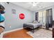 Light filled bedroom with a wrought iron bed and wood floors at 221 Rivers Edge Dr., Conway, SC 29526