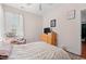 Bright bedroom with a recliner chair, light pink walls and wood floors at 221 Rivers Edge Dr., Conway, SC 29526