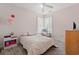 Bright bedroom with a soft chair near windows, a ceiling fan and wood floors at 221 Rivers Edge Dr., Conway, SC 29526