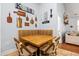 Cozy breakfast nook with striped seating and wooden table, decorated with kitchen-themed wall art at 221 Rivers Edge Dr., Conway, SC 29526