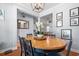 Cozy dining room with a large wooden table, chandelier, and natural light at 221 Rivers Edge Dr., Conway, SC 29526