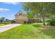 Home exterior with manicured lawn, lush landscaping, and a well-maintained front yard at 221 Rivers Edge Dr., Conway, SC 29526