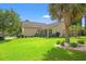 Charming home exterior with lush green lawn, mature landscaping, and fenced-in backyard at 221 Rivers Edge Dr., Conway, SC 29526