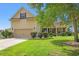 Charming home exterior featuring a well-manicured lawn, an attached garage, and stone accents at 221 Rivers Edge Dr., Conway, SC 29526
