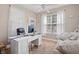Bright home office featuring a white desk, comfortable seating, and two windows providing ample light at 221 Rivers Edge Dr., Conway, SC 29526