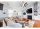 Bright and airy living room featuring a fireplace, tv and open layout at 221 Rivers Edge Dr., Conway, SC 29526