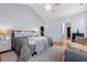 Spacious main bedroom featuring a ceiling fan, ensuite bathroom, and a walk-in closet at 221 Rivers Edge Dr., Conway, SC 29526