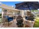 Backyard patio with egg chairs, firepit, umbrella and hot tub for outdoor relaxation and entertainment at 221 Rivers Edge Dr., Conway, SC 29526