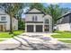 Beautiful two-story modern farmhouse-style home with a large driveway and a two-car garage at 2241 Sand Dunes Dr., Myrtle Beach, SC 29577