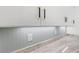 Stylish kitchen featuring white cabinets, sleek hardware, beadboard backsplash, and granite countertops at 2241 Sand Dunes Dr., Myrtle Beach, SC 29577