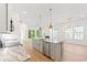 Kitchen island with stainless steel dishwasher, stone countertop and pendant lighting at 2241 Sand Dunes Dr., Myrtle Beach, SC 29577