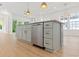 Modern kitchen island with gray cabinets, stainless steel appliances, and gold accents at 2241 Sand Dunes Dr., Myrtle Beach, SC 29577