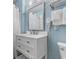 Bright bathroom with a modern white vanity, sleek fixtures, and fresh white towels at 300 N Ocean Blvd. # 128, North Myrtle Beach, SC 29582