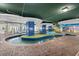 Relaxing indoor lazy river feature with colorful accents, perfect for a leisurely float at the resort at 300 N Ocean Blvd. # 128, North Myrtle Beach, SC 29582