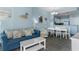 Cozy living room with ample seating, a dining area, and decor in the coastal style at 300 N Ocean Blvd. # 128, North Myrtle Beach, SC 29582