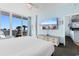 Comfortable main bedroom with a balcony view, large TV and easy access to the kitchen at 300 N Ocean Blvd. # 128, North Myrtle Beach, SC 29582