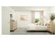 Serene main bedroom with natural light, a dresser, and a comfortable bed at 309 Warner Crossing Way, Loris, SC 29569