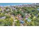 Aerial view of a coastal neighborhood with tree-lined streets, beautiful homes, and stunning ocean views at 315 14Th Ave. N, Surfside Beach, SC 29575