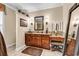 Bathroom featuring granite countertops, wooden cabinets, and a vanity area at 315 14Th Ave. N, Surfside Beach, SC 29575