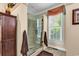 Bathroom featuring a glass enclosed shower and window with plantation shutters at 315 14Th Ave. N, Surfside Beach, SC 29575