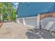 Spacious three-car garage with white doors and a gravel driveway at 315 14Th Ave. N, Surfside Beach, SC 29575